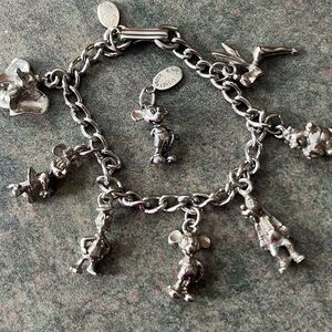 VINTAGE WALT DISNEY CHARM BRACELET WITH 8 CHARMS